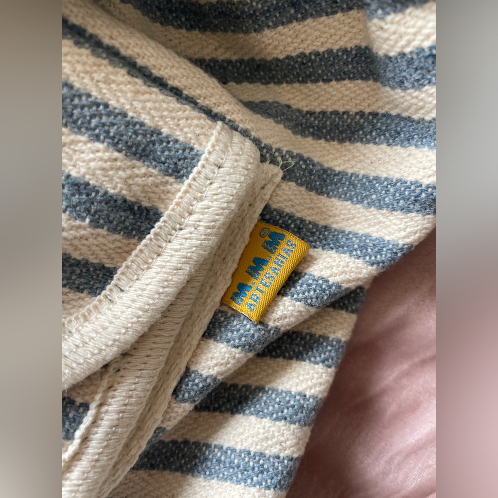 Striped blue and cream backpack with small zip pocket in front. - Picture 6 of 6
